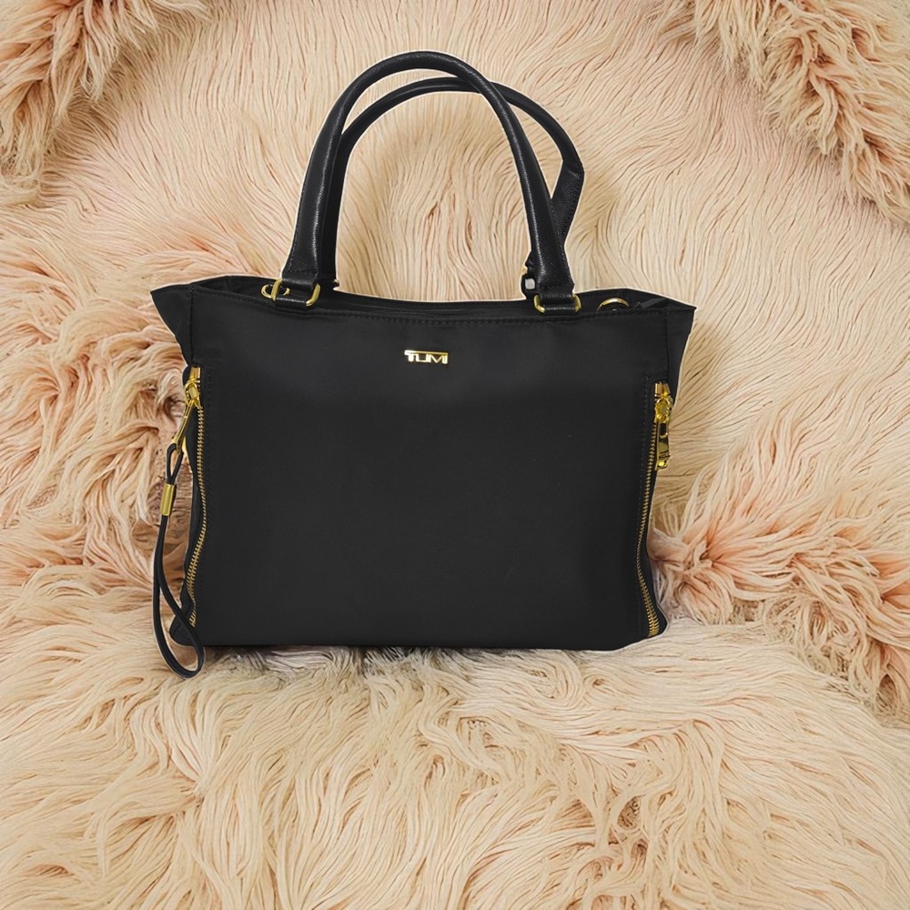 Tumi Elegant Black Tote with Gold Details
